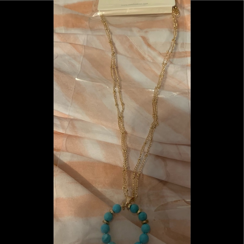 Riah Fashions gold and turquoise colored necklace